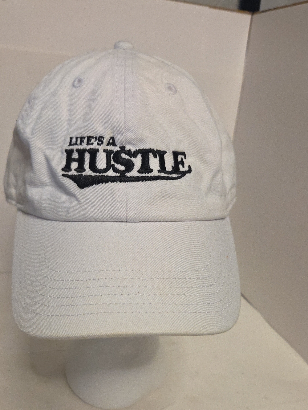 Life's A Hustle White Baseball Cap Normal Wear